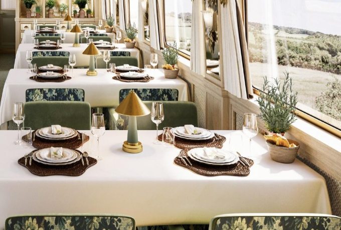 Belmond Britannic luxury train dining carriage with white-linen tables and panoramic countryside views