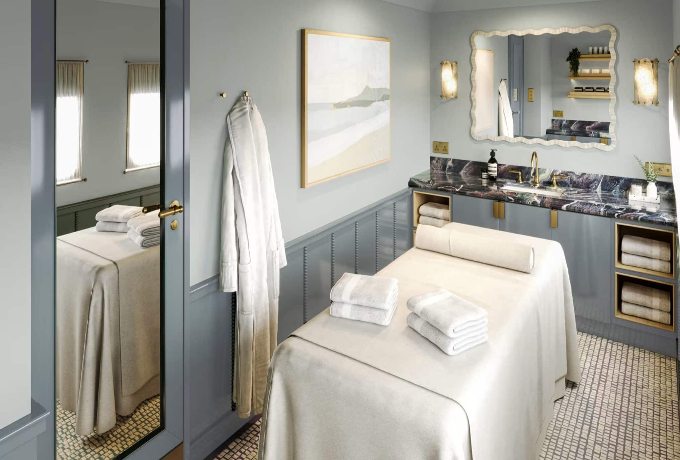 Belmond Britannic luxury train spa treatment room with massage table and countryside view