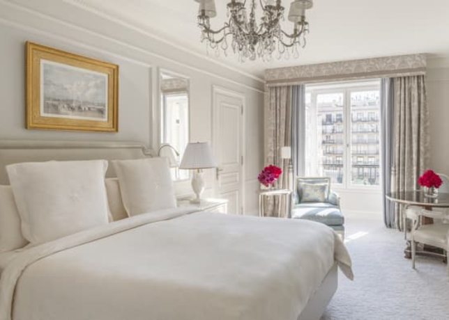 Four Seasons Hotel George V Paris exterior with elegant entrance and iconic floral displays