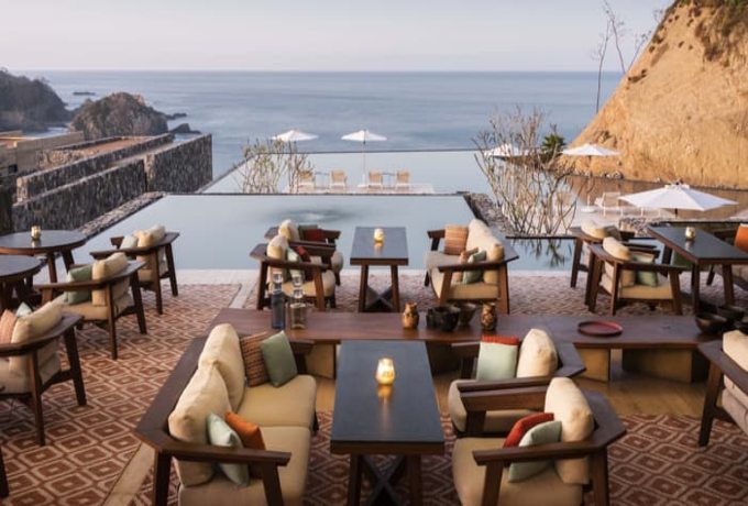 Poolside dining with panoramic sea view at Four Seasons Tamarindo luxury resort in Jalisco Mexico