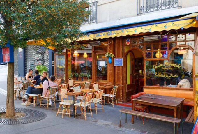 French café terrace and market scene showing everyday culture and dining etiquette in France