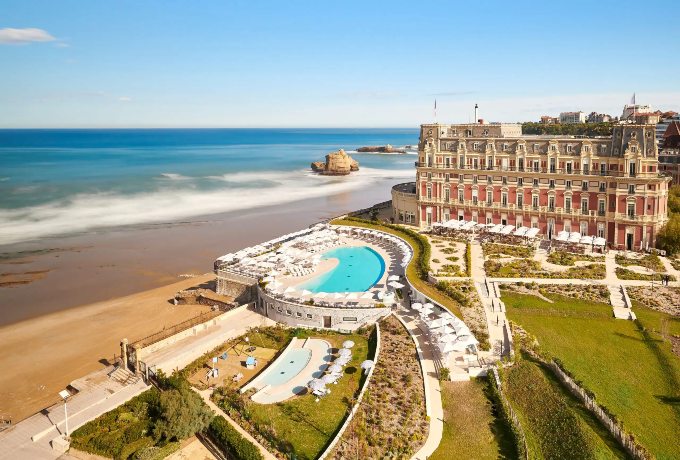 Aerial view of Hôtel du Palais in Biarritz with its pool and Grande Plage beach on the Atlantic coast