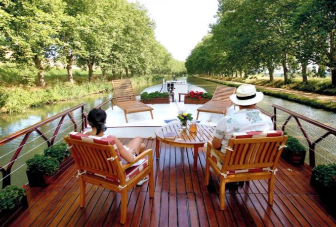 Belmond luxury river boat cruising through the French countryside