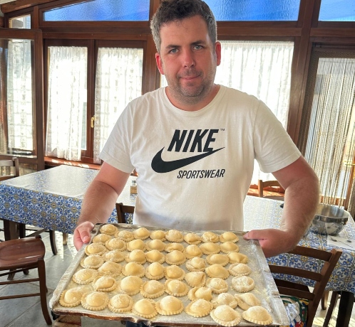 learning to make fresh pasta during a private cooking class in Italy