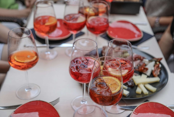 Table set with spritz cocktails and cicchetti during a private aperitivo tour in Venice, Italy